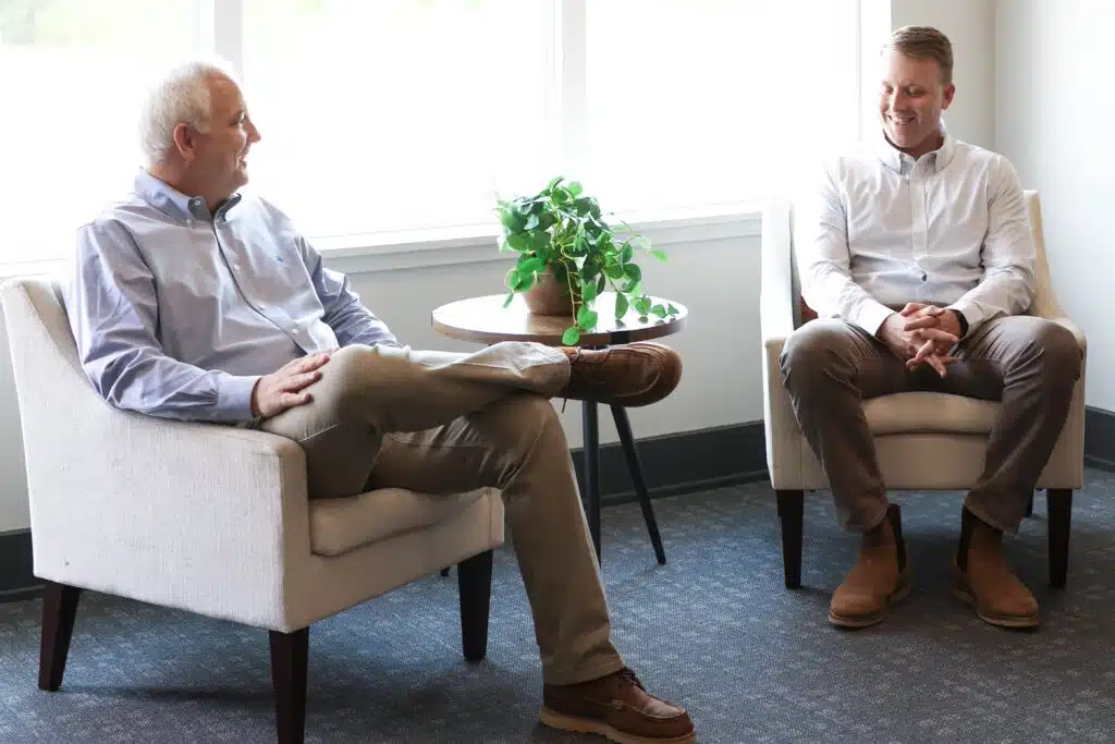 Two men sitting in a room.